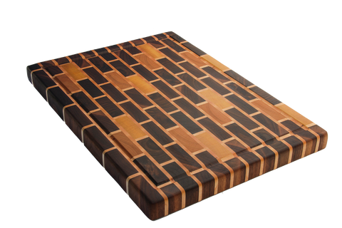 large walnut brick pattern end grain cutting board with cherry and yellow heart accents and juice groove.