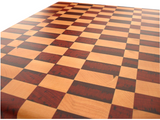 close up of traditional checker pattern maple and padauk end grain cutting board.