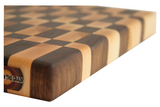 close up of traditional checker pattern maple and walnut end grain cutting board.