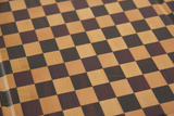 close up of multi colour checker pattern cutting board