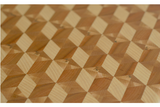 close up of tumbling block 3d pattern cutting board with maple, cherry, and ash