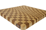 Close up of maple and cherry fading pattern end grain cutting board on white background