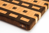 close up of end grain film pattern cutting board on white background