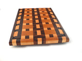 end grain film pattern end grain cutting board with juice groove on white background