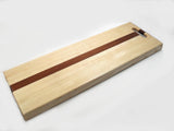 ash and sapele wood fillet board on white background