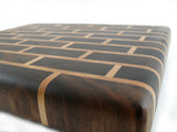 close up medium walnut brick pattern end grain cutting board
