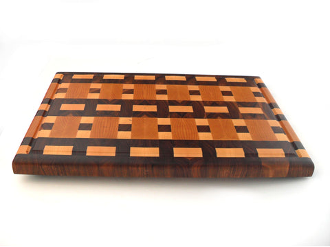 end grain film pattern end grain cutting board with juice groove on white background
