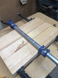 edge grain cutting board in clamps